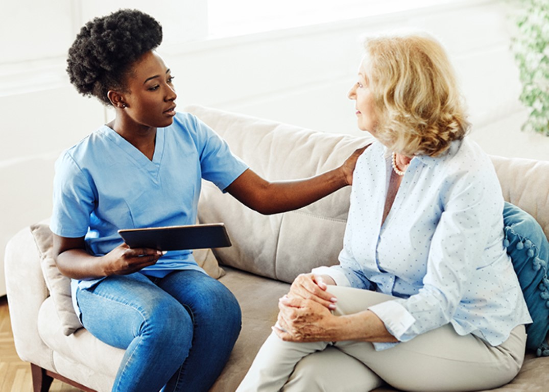 Healthcare professional providing daily living assistance