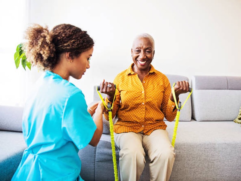 Healthcare professional providing physical therapy and rehabilitation services
